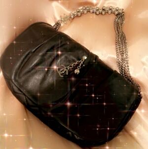 CHANEL Black Crossbody Bag with Silver Chain